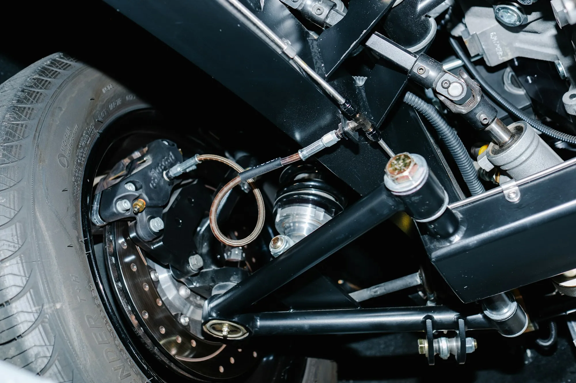 Close view of a chrome coil-over shock absorber